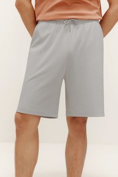 Looking for the perfect pair of shorts to bridge the gap between the couch and the gym? Our Men's Lounge Shorts will do the trick! Made from a breathable, skin-friendly cotton and Spandex blend, you’ll love wearing these shorts working in the yard, lounging around the house, during casual workouts, and even sleeping. Details Materials & Care Shipping & Returns • Soft fabric with a subtle sleek look, elastic waistband, and adjustable drawstring closure.• Front slant pockets, rear patch pocket: pl Sporty Bermuda Bottoms With Built-in Shorts, Loungewear Moisture-wicking Shorts, Relaxed Fit Knee-length Sports Shorts, Bermuda Sports Shorts With Elastic Waistband, Sporty Bermuda Athletic Shorts For Loungewear, Solid Color Knee-length Sports Shorts, Solid Moisture-wicking Knee-length Shorts, Solid Knee-length Sports Shorts, Moisture-wicking Knee-length Sportswear Shorts