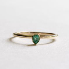 14k yellow gold natural petite emerald teardrop ring Metal: 14k yellow gold Stone: natural emerald Stone Size: 4mmx3mm Stone cut: Pear Stone Carat Weight: 0.17carat Dimension: Approx 1.5mm band. Emerald Teardrop Ring, 14k Yellow Gold Pear-shaped Emerald Ring, Pear-shaped Emerald Ring In 14k Yellow Gold, Teardrop Emerald Ring In Yellow Gold, Pear-shaped Emerald Ring In 14k Gold, Green Teardrop 14k Gold Ring, Gold Teardrop Emerald Ring, Teardrop Emerald Ring Fine Jewelry, 14k Gold Pear-shaped Emerald Ring