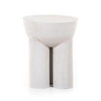 a white vase sitting on top of a table