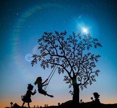 two children playing on a swing set under a tree with the moon in the background