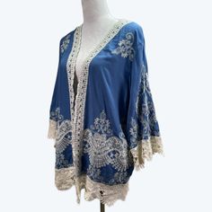 Solitaire New Rayon Embroidered Crocheted Lace Kimono Top Size L Blue Fitted Blue Bohemian Kimono, Blue Floral Embroidered Kimono For Spring, Blue Embroidered Kimono For The Beach, Bohemian Blue Kimono With Floral Embroidery, Blue Bohemian Kimono With Floral Embroidery, Blue Long Sleeve Kimono With Floral Embroidery, Luxury Blue Women's Kimono, Blue Bohemian V-neck Kimono, Luxury Blue Printed Kimono