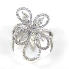 This Is A Fine Marquise Diamond Cluster Flower Curve Fashion Ring. It Is Made Of 100% Natural 14kt White Gold With A White Gold And Is In Brand New Condition. It Has A Ctw Of 1.98ct And Weighs 5.4 Grams. The Fancy Diamonds Have A Clarity Of Si1 And F Color. This Beautiful Custom Piece Has Excellent Marquise Cut Diamond Stones That Form Into A Cluster Around This Fashion Shaped Cocktail Ring. Samson Diamond Gia Certified Marquise White Gold Diamond Ring, Dazzling Marquise White Rings, White Marquise Cut Gia Certified Diamond Ring, Dazzling White Marquise Rings, Gia Certified Marquise Cut White Jewelry, Gia Certified White Marquise Cut Jewelry, White Gia Certified Marquise Cut Jewelry, White Pear-shaped Ring With Single Cut Diamonds, White Platinum Marquise Diamond Ring