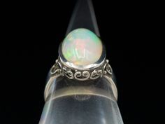 We've created this unique sterling silver ring to hold one of our luscious Ethiopian opals. Bright pink, soft blue, and lime green sparkles make for an outstanding ring! Metal: Sterling SilverGem: Ethiopian OpalGem Measurements: 16.0 x 10.0 mm, Oval Ring Size: 7.25Marks: "925" Stamped on the inside band Oval Ring, Oval Rings, Ring Metal, Eternity Bands, Ethiopian Opal, Bright Pink, Sterling Silver Ring, Lime Green, Silver Ring