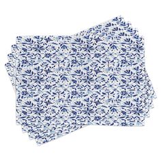 two blue and white napkins with small flowers on them