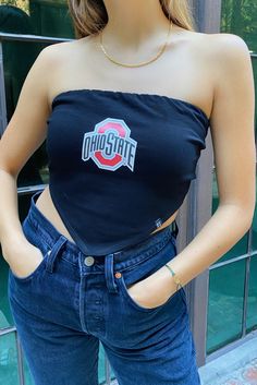 Solid college bandana top bandana top featured in a strapless, cropped silhouette with ruched elastic back and pointed bottom hem. Easy to style! About the style: Strapless Lined Adjustable back tie Slim fit Cropped About the fabric: 95% Cotton, 5% Spandex