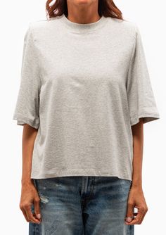 Isabel Marant Étoile's Ben Modern T-Shirt is a tee featuring a crew neckline, short sleeves and a boxy cut. Along with shoulder pads for an extra, fun flair. 100% Cotton Delicate cold wash, remove shoulder pads before washing, hang to dry Model is 5’8” and wearing a size XS. Runs true to size, we recommend taking your usual size. Model’s Measurements: 26” waist 34” hips 34" bust Oversized Short Sleeve Top With Crew Neck, Boxy Short Sleeve Tops For Everyday, Boxy Crew Neck Cotton Short Sleeve Top, Boxy Fit Short Sleeve Cotton Top With Crew Neck, Boxy Fit Cotton Short Sleeve Crew Neck Top, Boxy Fit Cotton Short Sleeve Top With Crew Neck, Cotton Boxy Fit Short Sleeve Crew Neck Top, Cotton Boxy Fit Short Sleeve Top With Crew Neck, Boxy Cotton Short Sleeve Crew Neck Top