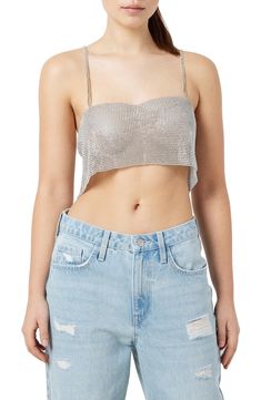 This festival-ready tank is designed in a cropped silhouette and covered in lustrous metallic studs. 6 1/2" center front length (size M/L) Sweetheart neck Sleeveless 50% plastic, 50% polyester Hand wash, line dry Imported Metallic Cropped Crop Top For Party Season, Metallic Cropped Top For Party Season, Metallic Sleeveless Halter Top For Night Out, Spring Embellished Sleeveless Halter Top, Fitted Metallic Glamorous Crop Top, Glamorous Embellished Sleeveless Crop Top, Metallic Crop Top For Summer Night Out, Glamorous Metallic Tank Top For Spring, Fitted Metallic Crop Top For Summer