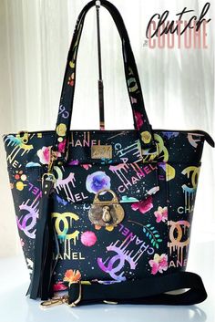 a black purse with colorful letters on it