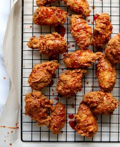 fried chicken on a cooling rack with ketchup