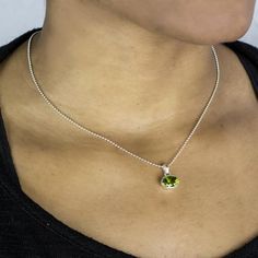 Vivid grassy green with a fiery sparkle, wear this juicy, fresh green gem to add a touch of luxury to your look. Peridot emits warm and friendly energy. Also known as the “gem of the sun”; Ancient Egyptians felt the warm glow of the sun’s energy through the vivid, green glimmer. Peridot provides a shield of protection for its wearer and is an excellent healing stone that helps one strengthen and regenerate the body and mind. Stone Origin: Pakistan Please Note: All pieces shipped within 48 hours Peridot Crystal Necklace, Luxury Peridot Birthstone Necklace, Silver Pendant Necklace With Peridot, Luxury Peridot Pendant Necklace, Peridot Gemstone Pendant Necklace, Peridot Crystal, Peridot Pendant, Oval Necklace, Peridot Necklace