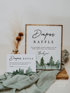 a couple of cards sitting on top of a table next to a vase filled with flowers