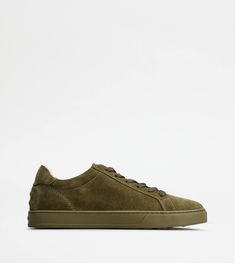 A sober and sophisticated taste characterizes these sneakers with minimal lines, with Tod's logo on the tongue. Crafted in soft suede, they come with a rubber outsole with embossed rubber pebbles. Green Suede Lace-up Sneakers, Green Suede Sneakers With Contrast Sole, Green Suede Sneakers With Round Toe, Green Suede Sneakers With Rubber Sole, Classic Green Sneakers With Textured Sole, Modern Green Sneakers With Textured Sole, Green Casual Sneakers With Leather Sole, Casual Green Sneakers With Leather Sole, Green Leather Sole Sneakers For Streetwear