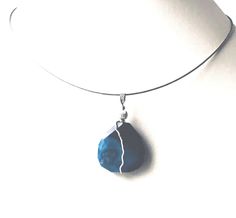 When I create pendants I use beautiful semi-precious gems like agate, jasper, onyx, lapis, turquoise, quartz and so many other unique gems. This is a beautiful plum blossom agate or blue Sakura agate that gives the appearance of blossoms deep in the gemstone. It's a deep rich blue which contrasts nicely with the sterling silver.   A simple sterling silver wire wrap enhances the natural markings within the stone and forms a bail  that is big enough to accommodate a larger chain or cord. This makes it a very versatile piece of jewelry. A long cord looks great with a tunic.     The 18 inch neck wire included with your purchase. A pendant is perfect when you want your jewelry to be seen but don't want to wear a larger necklace. My pendants are striking so please check the measurements! Crystal Adjustable Moss Agate Gemstone Jewelry, Turquoise Agate Teardrop Jewelry, Turquoise Teardrop Agate Jewelry, Agate Teardrop Pendant With Natural Stones, Agate Teardrop Pendant Jewelry With Natural Stones, Agate Gemstone Teardrop Pendant Jewelry, Agate Natural Stones Teardrop Pendant Jewelry, Teardrop Pendant Agate Jewelry With Natural Stones, Blue Agate Pendant Jewelry