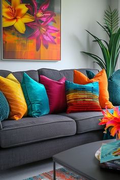 a living room filled with lots of colorful pillows and furniture in front of a painting on the wall