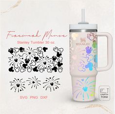 the tumbler cup is decorated with flowers and sparkles, as well as an insulated sticker