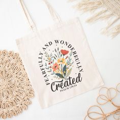 a tote bag sitting on top of a table next to some eyeglasses