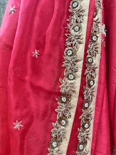 This gorgeous red raw silk bridal lehenga with zardosi and sequins work butti is teamed with a red heavy cutwork blouse. This outfit is completed with a red organza embroidered dupatta.
*Ready to ship in sizes XS, S, M, L Red Designer Dupatta For Festivals, Festive Red Raw Silk Dupatta, Red Dupatta For Designer Wear Festivals, Red Designer Wear Dupatta For Festivals, Red Floor-length Sharara With Zari Work, Red Tissue Silk Dupatta For Wedding, Red Sharara With Resham Embroidery And Traditional Drape, Raw Silk Dupatta With Gota Work For Reception, Red Sharara With Resham Embroidery