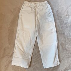 Nwot Hanna Andersson White Beach Pants. Roll Up And Button For A Capri Length Or Roll Down For Full Length Long Pants. Two Side Pockets And One Back Pocket, 100% Cotton. Elastic Waist With Draw String To Adjust Size. Boys Or Girls Size 130, Approximately 8 Years. From A Smoke-Free Home. Casual White Pull-on Pants, White Casual Pull-on Bottoms, Casual White Pull-on Bottoms, Casual High-waisted Cotton Chinos, Casual White Ankle-length Parachute Pants, Casual Cropped Leg Chinos With Pockets, Casual Solid Color Cotton Capris, White Straight Leg Casual Capris, Casual Cropped Leg Chinos For Spring