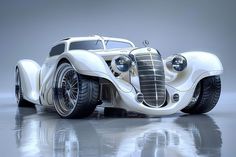 an old fashioned white car is parked on the floor in front of a gray background