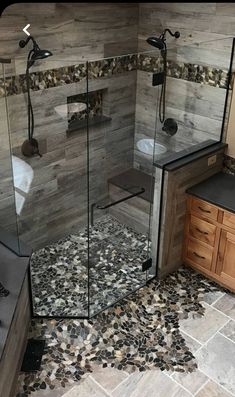 a walk in shower sitting inside of a bathroom