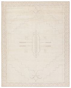 a white rug with an intricate design on the front and back side, in neutral tones