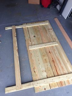 the unfinished door frame is ready to be installed on the floor in the garage or workshop