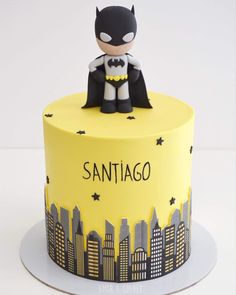 a batman themed cake with the name sanitago on it