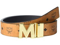 MCM Claus Reversible Belt - Men's Belts : Cognac : Keep your opulent options open wearing the MCM Claus Reversible Belt. Leather belt with a gold-tone logo shaped buckle. Single hardware strap keeper. Reversible design. Spot clean. Imported. Measurements: Width: 1 3 4 in First Hole Length: 47 in Last Hole Length: 43 in Weight: 10 oz Boat Shoes Fashion, Logo Shapes, Men's Belts, Belt Leather, Branded Belts, Reversible Belt, Embossed Logo, Mens Belts, Belt Buckles