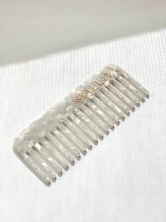 Introducing our premium LIMITED EDITION OG Comb. Beautiful enough to display in your bathroom and functional enough to slip into your purse. Perfect to use at home, out or salon use for instaworthy hair. - Environmentally friendly- Anti Static to prevent breakage- Round tip teeth- Strong, flexible and lightweight Great for your hair, great for the environment Malliya Combs are made using environmentally friendly cellulose acetate. Acetate is a plant based plastic which is 100% sustainable and known for its strength and flexibly as well as being extremely lightweight. This make it perfect for styling wet or dry. It is also hypoallergenic, which means that it is kind to sensitive skin and unlikely to cause any allergic reactions. Say goodbye to static and snagging Using the right tools for y Wide Tooth Comb, Plant Fibres, Cellulose Acetate, Split Ends, Metallic Hair, White Quartz, Hair Comb, Hair Looks, Diamond White