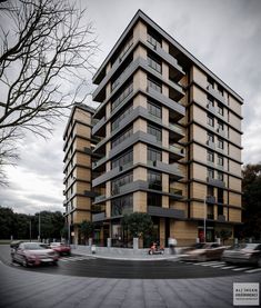 a very tall building sitting on the side of a road next to a street filled with cars