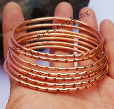 Set of 7 PCs. Handmade Bangles / Pure Copper Bangle Set Of Solid Copper Bangle / pure copper Jewelry/ Bangles For Women/ free shipping                                                                             Welcome to Silver Artisen Ring Benefits of Copper Bangle Wearing jewellery made from this metal does not just look beautiful - it can heal, too. This noble and beautiful metal protects from infections, boosts blood flow and circulation, and regulates body heat. It can also protect from se Handmade Copper Bangle, Copper Bangle Gift, Gold Round Copper Bangle, Jewelry Bangles, Bangles For Women, Handmade Bangles, Bangle Set, Body Heat, Bangles Jewelry