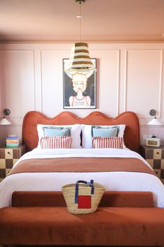 a bedroom with a bed, checkered flooring and a painting on the wall