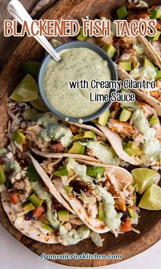 a plate filled with tacos and guacamole sauce