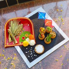 an assortment of food on a tray with rice and other things to eat in it