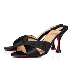 The timeless and elegant Nicol is Back mule is embellished with two black satin crepe bands. Designed according to specific know-how particular to Maison Christian Louboutin, they intersect and form a refined drape that shows off the foot by creating a tapered notch. The clean lines of this model sitting atop an 85 mm heel give it a sophisticated charm. Material : Crepe satin Color : Black Heel height : 85 mm Model Sitting, 2022 Shoes, Dr Shoes, Satin Noir, Louboutin Heels, Black Accessories, Red Sole, Red Bottoms, Dream Shoes