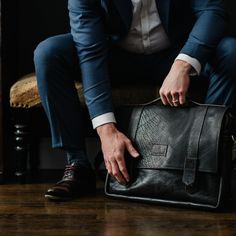 THIS collection is especially for him. The Tyler Brief is the perfect combination of rugged texture + handsome lines. Made from both bison + cow hide leathers, the messenger bag is the perfect carry all. Our heavy strap crossbody strap sits either crossbody or on your shoulder distributing the weight comfortably. Every Tyler Brief is unique due to our hides natural color variations + texture. Truly a work of art! Dimensions: 17" x 12" x 2.5" Features : -zippered closure -button flap -2 outside f Luxury Briefcase For Daily Use, Black Bags With Leather Lining For Everyday Carry, Black Bags With Leather Lining For Everyday, Black Bag With Leather Lining For Everyday Carry, Timeless Business Crossbody Briefcase, Timeless Crossbody Briefcase For Business, Timeless Business Briefcase, Crossbody Style, Leather Lining Crossbody Briefcase For Business, Leather Lined Crossbody Briefcase For Business