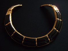 "Vintage Designer Signed ESSEX Jewellery Ladies Costume Fashion Accessories Super Gorgeous Geometric Ethnic Style Design Jewelry Design Shiny Gold Tone Metal With Black Glass, Acrylic or Resin Sleek Double Rigid Hinged Collar Necklace Beautiful Bold and Fabulous The flexible hinged ends opening for ease of dress. Measures approximately 15\" to 17\" long by 7/8\" wide (at the widest point). Well made very good quality piece of jewelry and it weighs 138.5 grams. this fabulous necklace is in very g Luxury Black Enamel Statement Necklace, Elegant Black Ceremonial Necklace, Black Bohemian Necklace For Formal Occasions, Bohemian Black Necklace For Formal Occasions, Costume Fashion, Cameo Necklace, Brass Necklace, Design Jewelry, Ethnic Style