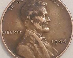 an image of a penny with the words liberty on it's back and side