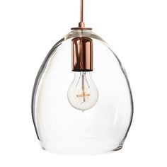 a clear glass light bulb hanging from a ceiling fixture with a black cord attached to it