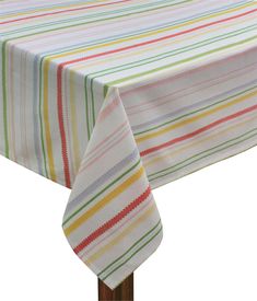 a striped table cloth on top of a wooden stand with a white background and multicolored stripes