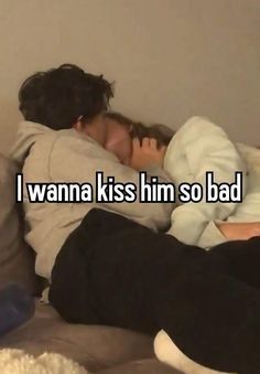 a man and woman laying in bed with the caption i wanna kiss him so bad