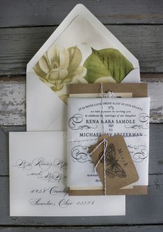 wedding stationery and envelopes with flowers on them