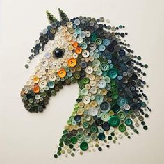 a horse made out of buttons on the wall