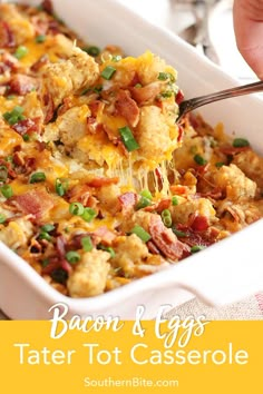 bacon and eggs tater tot casserole in a white dish with a spoon