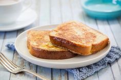 two pieces of toast on a white plate