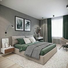 a bedroom with green and white decor in the corner, along with two framed pictures on the wall