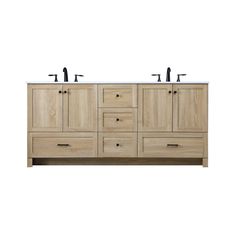 the double sink vanity has two black faucets on each side and is made from wood