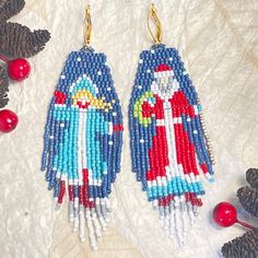 DETAILS:  - Original design  - Complimentary gift wrap - Technique: Handwoven - Color: Blue, red, turquoise, white - Material: Japanese Miyuki glass seed beads - Ear wire: Leverback - Allow for 3-5 business days for completion of your unique earrings plus shipping time Follow me on Facebook and Instagram to see my latest designs! @littleredkerchief Festive Handmade Blue Beaded Earrings, Bohemian Christmas Earrings For Festive Occasions, Bohemian Christmas Earrings, Handmade Multicolor Earrings For Holiday, Handmade Multicolor Holiday Earrings, Blue Earrings For Christmas Gift, Holiday Multicolor Handmade Earrings, Handmade Multicolor Christmas Earrings, Black Folk Art