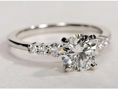 an engagement ring with three stones on it