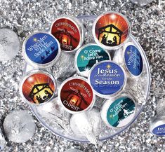 an ice tray filled with jesus's birth candles on top of crushed silver rocks